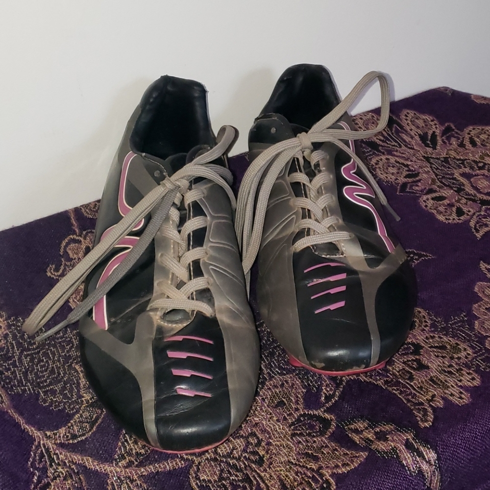 Worn grey and pink cleats